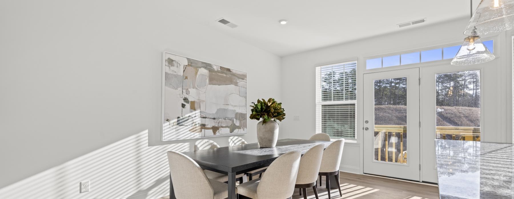 a dining room with a table and chairs